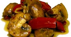 chicken with peppers and mushrooms on a white plate, ready to be eaten or served