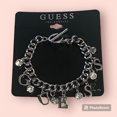 Brand New Guess Logo Silver Charm Bracelet Toggle Clasp Crystal And Letter Charms Length Is 7”, But W/Clasp It’s 7.5” Comes Boxed Ready For Gifting! Free Gift W/Purchase! Bundle 2 Or More Listings For Additional 10% Off All Reasonable Offers Are Welcome. I Can’t Say Yes If You Don’t Ask! Thanks For Looking Through My Happy Poshing! 2010 Jewelry, Xoxo Jewelry, Jewelry Closet, Handmade Charm Bracelets, Dope Jewelry Accessories, Charm Bracelet Silver, Guess Jewelry, Charms For Bracelets, Guess Logo