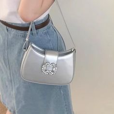 UAKISS - Silver Elegant Womens Handbag Casual Pu Leather Luxury Designer Korean Fashion Shoulder Bag Advanced Square New Armpit Bag Specification: Material: PU leather Size: (Upper width)18/(Lower width)20*15*6 cm (Due to manual measurement, the size may have 1-4cm error.) Color: White,Black,Blue,Silver Straps: 1 Usage: Shoulder Bag,Handbag,Armpit Bag (Due to the monitor and lighting problems, a slight color difference is normal.) The bag is small, so please pay attention to the size. Silver Square Shoulder Bag For Evening, Chic Silver Rectangular Shoulder Bag, Silver Shoulder Bag For Everyday, Silver Rectangular Shoulder Bag For Party, Silver Pouch Evening Bag For Everyday Use, Chic Silver Pouch Evening Bag, Chic Silver Clutch Shoulder Bag, Trendy Silver Shoulder Bag For Everyday Use, Chic Silver Handheld Shoulder Bag