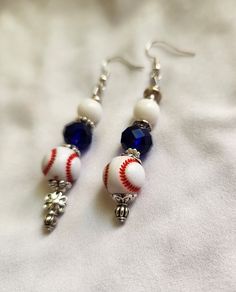 Dangle baseball earrings in white, blue and red. Earrings are 2.75" in length. Casual Blue Jewelry For Game Day, Baseball Beaded Earrings, Baseball Resin Earrings, Baseball Leather Earrings, Volleyball Earrings, Sports Team Earrings, Baseball Earrings, Diy Earrings Easy, Diy Earrings