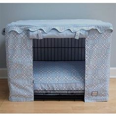 a dog bed with a blue and white cover