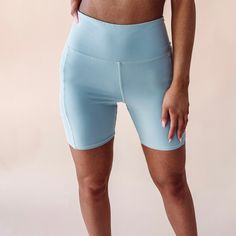 - 88% Polymade, 12% Elastane - True to size - Model is pictured in a size small Take your workout look to the next level in our Selena Biker Shorts. These comfy, supportive shorts are perfect for any athletic activity - they'll keep you feeling confident and looking cool while you're pushing your body to the limit. Plus, they come in a sleek blue hue, so you can wear 'em with style! Athleisure Athletic Shorts With Contoured Waistband, Sweat-resistant Stretch Athletic Shorts Mid-thigh Length, Stretch Sweat-resistant Mid-thigh Athletic Shorts, High Stretch Go-dry Athletic Shorts, Athleisure Running Shorts, Sports Activewear Shorts, Athleisure Biker Shorts For Yoga Knee-length, Casual Sweat Resistant Activewear Shorts, High-waisted Athleisure Biker Shorts For Training