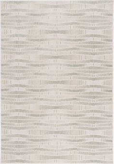 a white rug with wavy lines on it