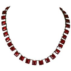 Unusual Art Deco faux ruby crystal riviere. The deep ruby faceted square cut crystals are set in open back silver gilt linked settings. Excellent Condition. 1920's France. Length 15.25 " Width 5/16" Luxury Ruby Rectangular Jewelry, Luxury Silver Ruby Necklace, Luxury Brilliant Cut Ruby Necklace, Vintage Rectangular Ruby Jewelry, Luxury Vintage Ruby Necklace, Flapper Necklace, Square Necklace, Ruby Crystal, Gold Necklace Set