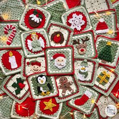 crocheted christmas decorations are displayed on a tablecloth with lights and garlands