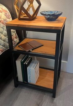 a table with books and a bowl on it