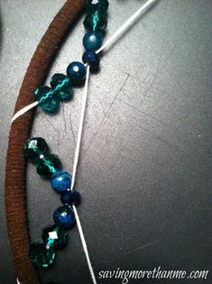 the beaded necklace is being worked on