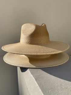 THE SUN-TANNED ORIGINAL RANCHER WITH A TRADITIONAL FIT... Crafted from 100% fine palm leaf straw, our hats boast an organic origin, making them not only environmentally friendly but also re-shapable, and water-shedding. The exceptional quality of our pure palm leaf hats is accentuated by their self-conforming feature, ensuring a personalized fit that effortlessly shapes to the contours of your head. Its easily moldable nature caters to the preferences of hat enthusiasts and milliners alike, addi Rancher Hat, Beach Vacay, Inclusive Design, Winter Mode, Straw Hats, Island Vibes, Tropical Island, Sun Tan, Palm Leaf