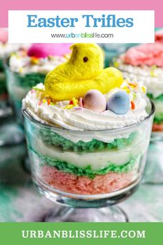 This easy and delicious Easter Trifle is a layered dessert made with cake mix, pudding, shredded coconut, and whipped cream, topped with your favorite Easter candies. Get the recipe at UrbanBlissLife.com. Easter Trifle, Speckled Egg Cake, Green Velvet Cake, Easter Candies, Vanilla Pudding Recipes, Cake Pudding, Layered Dessert, Easter Pudding, Trifle Dish