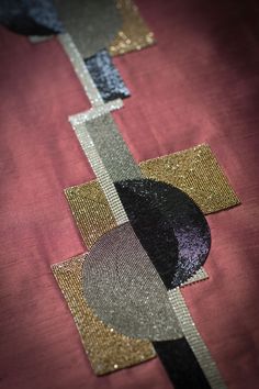 the fabric has been stitched together with sequins