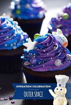 there are cupcakes with blue frosting and stars on them that say celebration outer space