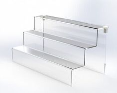 three tiered glass display case on white background