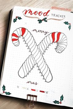 a notebook with some candy canes on it