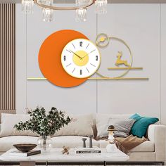 a living room with a couch, coffee table and clock on the wall above it