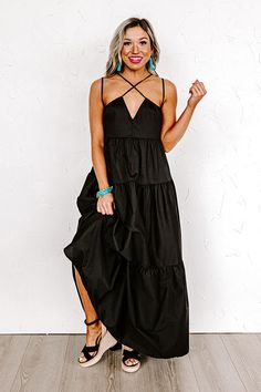 - Perfect for a sunny day, this beautiful dress is a trendy option for your maxi dress selection! - An unlined lightweight material - A v-cut neckline - Spaghetti straps as well as a second pair of spaghetti straps with front crisscross detail - Hidden side pockets - A flowy tiered silhouette that ends in a straight ankle length hemline Black V-neck Maxi Dress For Date Night, Black Maxi Sundress For Party, Black Linen Maxi Dress For Spring, Black V-neck Sundress For Beach, Black V-neck Sundress For The Beach, Black Maxi Dress For Spring, Black Maxi Dress For Spring Day Out, Spring Black Maxi Dress For Day Out, Chic Black Maxi Dress For Spring