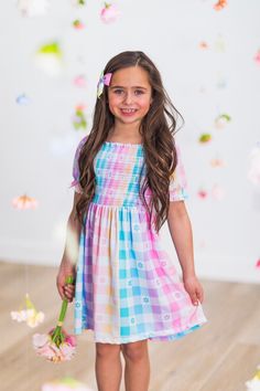 *Please refer to size chart for the best fit* Girls' Easter dress features a stretchy, smocked bodice Puff sleeves with elastic cuffs Ultra-soft material for comfort & ease Pull-over style for fit & easy dressing Add sweet fluttery style to her Easter look with this Pastel Rainbow Gingham Flower Dress. This girls' dress is styled with an adorable plaid flower pattern for an adorable look. This short sleeve design makes it a staple addition to her Easter wear, while the pull-over style allows for simple dressing. Pair this darling dress with a matching SIP bow or a pair of sandals for the perfect look! bullets:Includes: Dress only 100% Polyester Barbie Poses, Rainbow Gingham, Simple Dressing, Sparkle In Pink, Short Sleeve Design, Darling Dress, Dresses Xxl, Easter Dress, Flower Dress