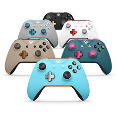 four different colored video game controllers