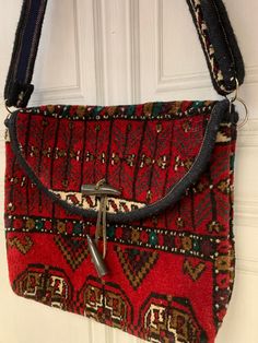 A stunning English vintage carpet bag, made from a woollen Persian rug textile and comes in a vibrant red, it's a good size to at 34cm w x 32cm high, it's a comfortable shoulder bag and nicely lined in a blue fabric, a great authentic vintage item ready to go Vintage Red Shoulder Bag For Travel, Vintage Red Everyday Bag, Vintage Red Carpet, Retro Red Travel Bags, Vintage Red Bag With Removable Pouch, Vintage Carpet Bag, English Vintage, Carpet Bag, Rug Bag