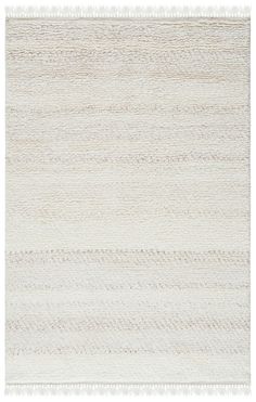 a white rug with wavy lines on the bottom, and an area that has been made from