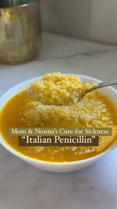 a white bowl filled with soup on top of a table