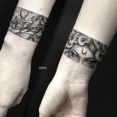 two wrist tattoos with flowers on them