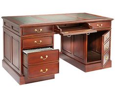 an antique wooden desk with two drawers and a file cabinet on the bottom, one drawer open