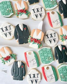 decorated cookies are arranged in the shape of grooms suits and ties, with names on them