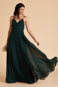 a woman in a long green dress