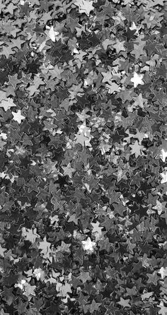 black and white photograph of stars on the ground for wallpaper or background stock photography