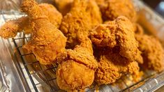 some fried food is sitting on a cooling rack