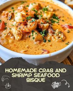 a close up of a bowl of food on a table with the words homemade crab and shrimp seafood bisque