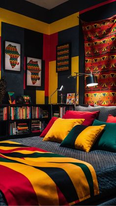 a bedroom with black, yellow, red and green colors on the walls next to a bed