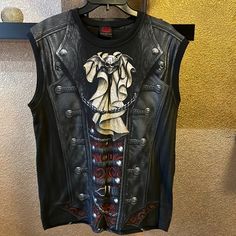 Mens Size Large New Without Tags! Pet And Smoke Free Home No Steam Punk Biker Should Be Without This. Realistic Leather, Laces & Buckles With A Metallic Winged Skull And Cravat. This Is Heavy Metal With A Twist Of Victorian Elegance, And Every Bit The Gothic Spiral Masterpiece. Allover Sleeveless T-Shirt Black Is Made Of Top Quality 100% Cotton, Interlock Using Skin Friendly, Azo-Free, Reactive Dyes. Victorian Elegance, Winged Skull, The Gothic, Sleeveless T Shirt, Steam Punk, Sleeveless Tshirt, Heavy Metal, Black Tshirt, Tank Top Shirt