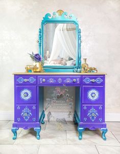 a blue and purple desk with a mirror on top