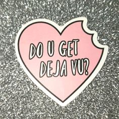 a pink heart sticker with the words do u get deja vu? on it