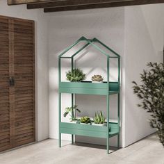 a green shelf with plants in it next to a door