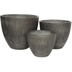 three cement pots sitting next to each other