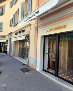 the storefronts of saint - laurent boutiques are empty