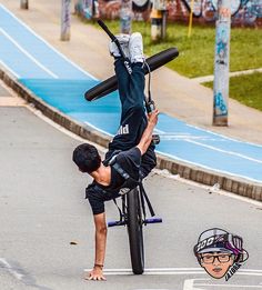 a man is doing tricks on his bicycle