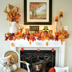 a living room filled with furniture and a fire place covered in fall colored leaves on top of a mantel