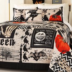 a black and white halloween themed bed spread