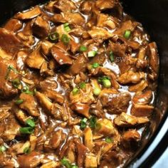 a pan filled with meat and vegetables covered in gravy