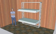 a man standing in front of a bunk bed with two shelves on each side and another shelf above it