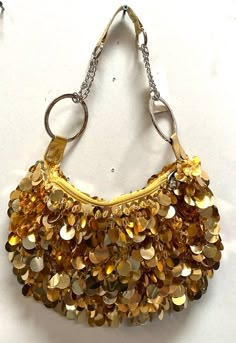 Sequin Handbags  are   hand-made, high quality, original designs, and beautiful. They are unique for evenings and special events and their designs are inspired by contemporary fashion and vintage looks. Sequin handbags are a perfect balance of aesthetics and functionality. Size: 1"x8" Large Vintage Summer Party Bags, Retro Gold Shoulder Bag, Vintage Gold Shoulder Bag For Party, Vintage Pouch Bag For Party, Gold Handheld Evening Bag For Festivals, Trendy Tote Evening Bag For Party, Trendy Evening Tote Bag For Party, Summer Party Pouch Shoulder Bag, Vintage Party Tote Bag