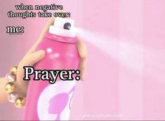 a pink spray bottle with the words prayer written on it and a hand spraying water