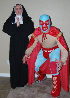 two people dressed in costumes standing next to each other on the floor with one wearing a mask