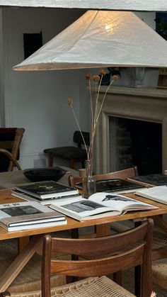 a lamp that is sitting on top of a table in front of a fire place