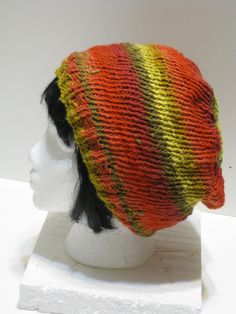 Beautiful hand knit unisex beanie in bright yellows, greens, reds and orange. 100% Acrylic. One size fits most. (Feels like cotton yarn.) Ready to ship. Handmade Multicolor Casual Bonnet, Casual Handmade Multicolor Bonnet, Multicolor Casual Bonnet One Size, Casual Multicolor Bonnet One Size, Casual Multicolor Bonnet, Colorful Casual Beanie Hat, Multicolor Slouchy Hat For Fall, Multicolor Slouchy Casual Hat, Casual Multicolor Bonnet Cap