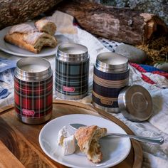 a plate with some food on it next to two canisters