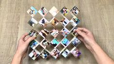 two hands are holding several photos in the shape of a diamond on a wooden table